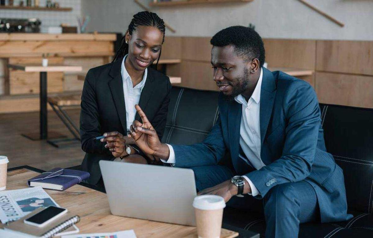 Black banker reviewing documents